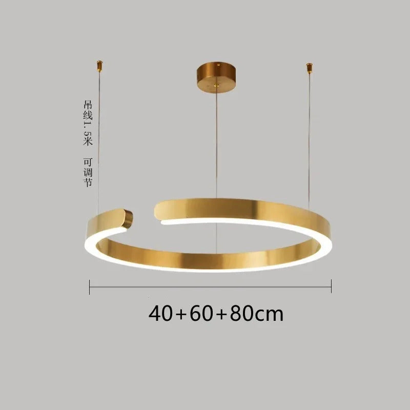 Moderno candeeiro suspenso LED em formato de anel, com intensidade regulável, nas cores dourado e preto, ideal para mesas, salas de jantar, cozinhas e quartos. Design minimalista e elegante. 