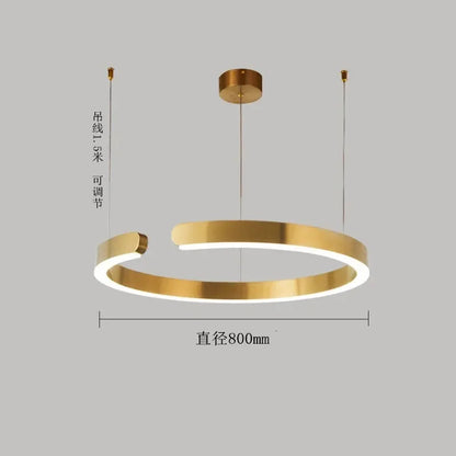 Moderno candeeiro suspenso LED em formato de anel, com intensidade regulável, nas cores dourado e preto, ideal para mesas, salas de jantar, cozinhas e quartos. Design minimalista e elegante. 